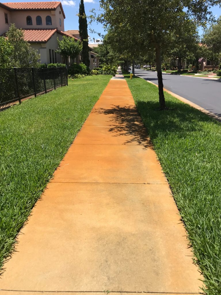 rust stain on sidewalk